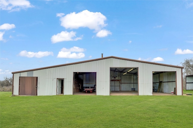 view of outdoor structure with a lawn