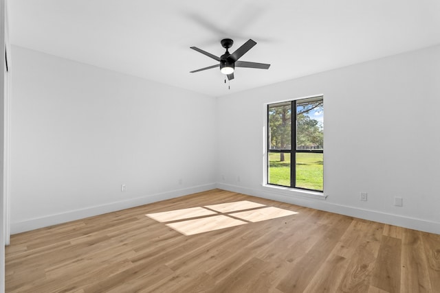 empty room featuring light hardwood / wood-style floors and ceiling fan