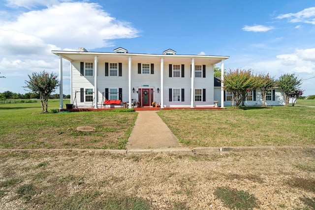 view of front of home with a front lawn