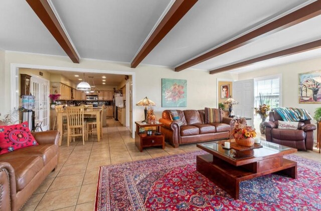 sitting room featuring light hardwood / wood-style floors and beamed ceiling