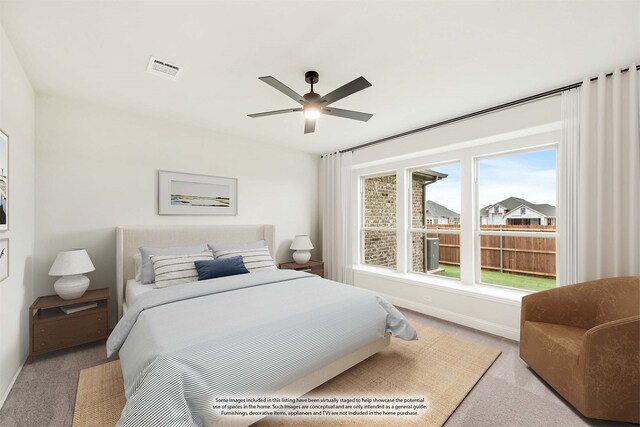 carpeted bedroom with baseboards, visible vents, and a ceiling fan