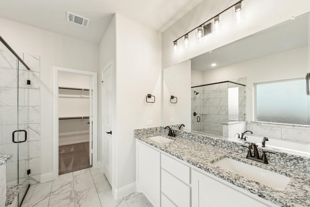 full bathroom featuring a sink, visible vents, marble finish floor, a spacious closet, and a shower stall