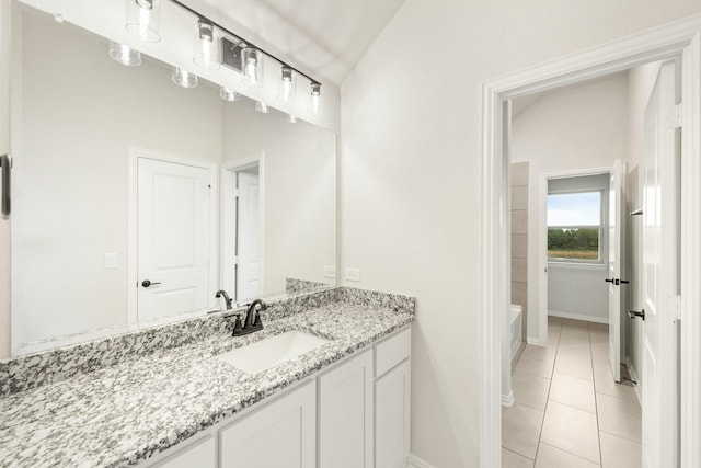 bathroom featuring a shower, tile patterned floors, vanity, baseboards, and a bath