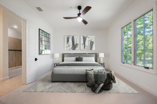 bedroom with ceiling fan, light carpet, ornamental molding, and multiple windows