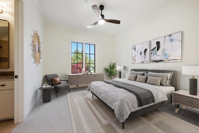 bedroom featuring ornamental molding, ceiling fan, and light colored carpet