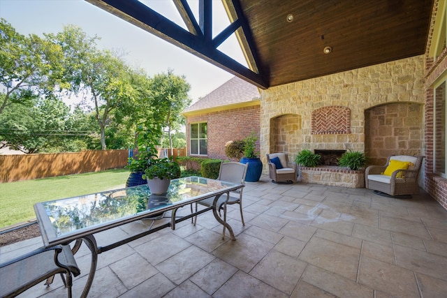 view of patio / terrace featuring an outdoor stone fireplace