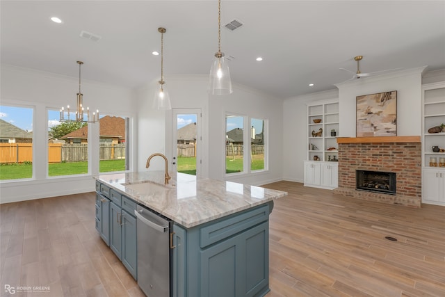 kitchen with dishwasher, an island with sink, light stone countertops, and plenty of natural light