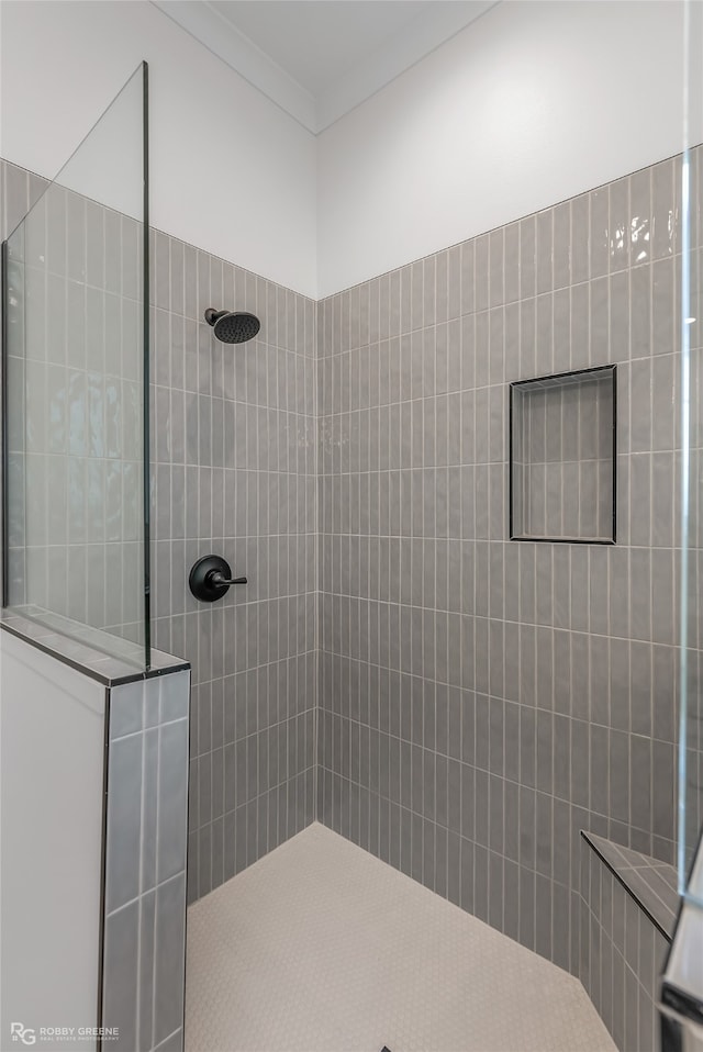 bathroom with a tile shower