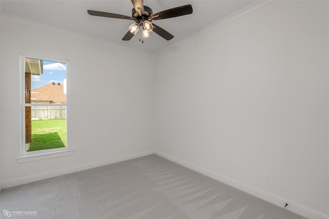 unfurnished room with carpet floors, crown molding, and ceiling fan