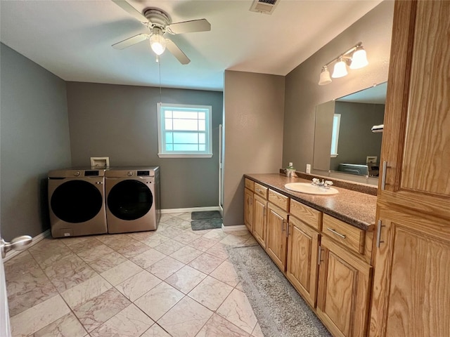 bathroom featuring vanity, tile flooring, ceiling fan, and washing machine and clothes dryer