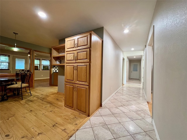 hallway with light tile flooring