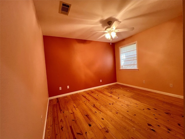 unfurnished room featuring light hardwood / wood-style floors and ceiling fan