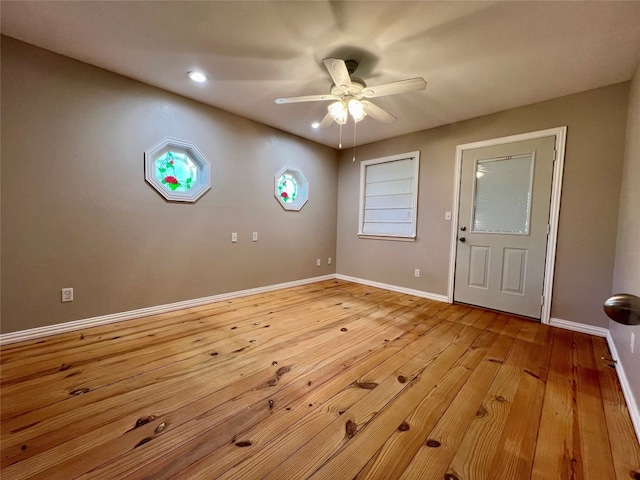 unfurnished room featuring light hardwood / wood-style floors and ceiling fan