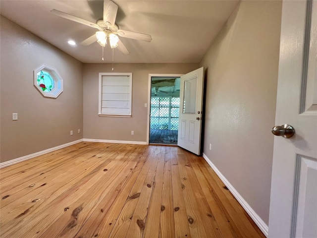 spare room featuring ceiling fan and light wood-type flooring