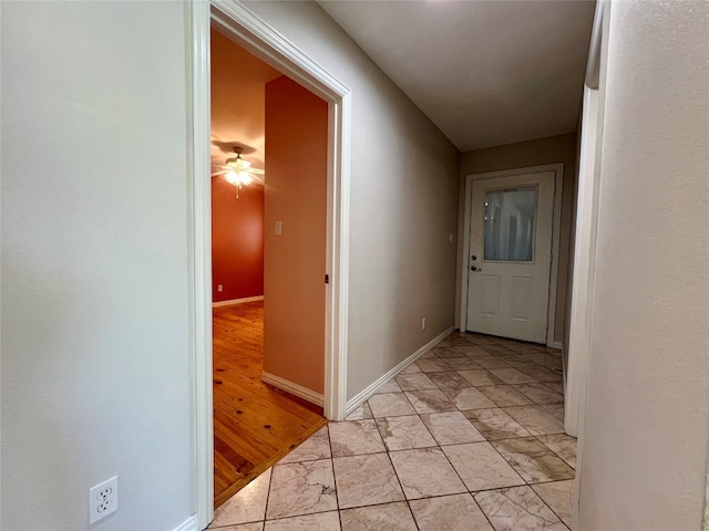 hallway with light tile floors