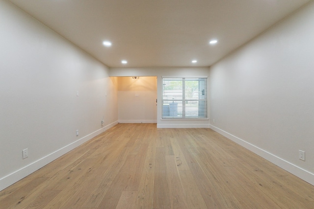 spare room with light hardwood / wood-style flooring