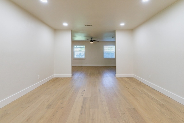 unfurnished room featuring ceiling fan and light hardwood / wood-style floors