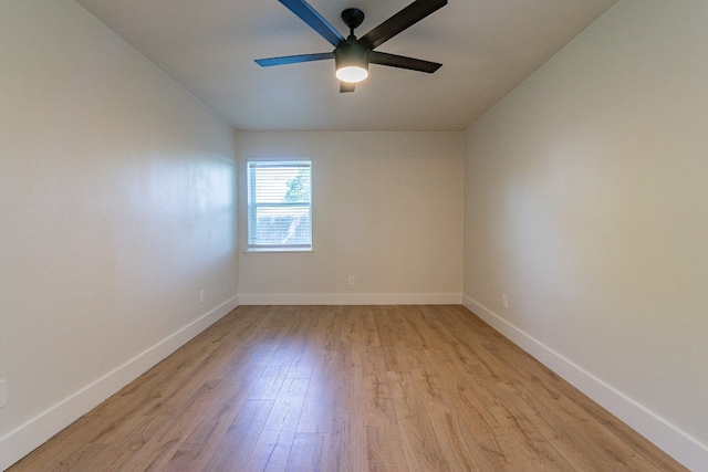 spare room featuring light hardwood / wood-style floors and ceiling fan