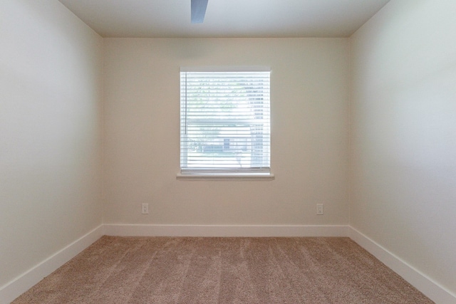 unfurnished room with light colored carpet