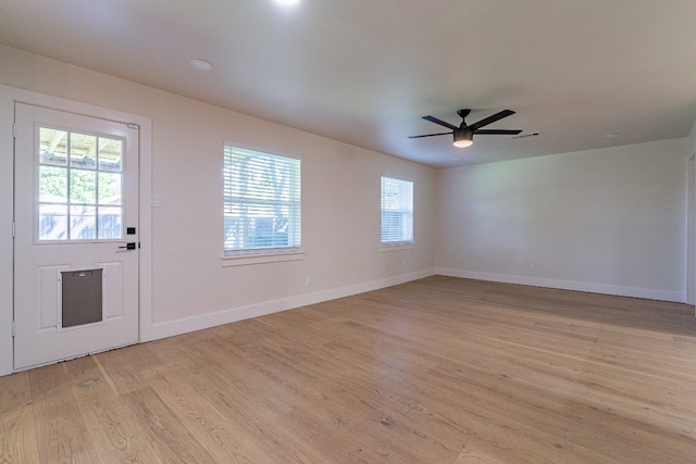 spare room with light hardwood / wood-style floors and ceiling fan