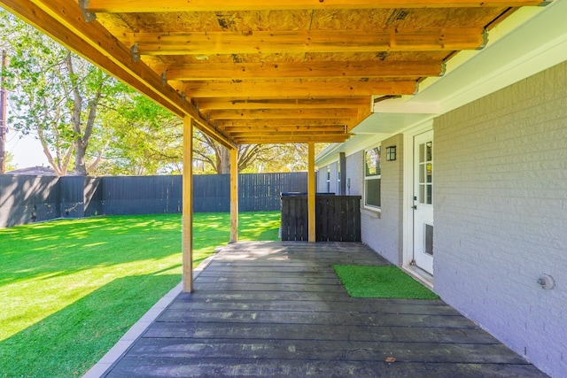 wooden terrace with a yard