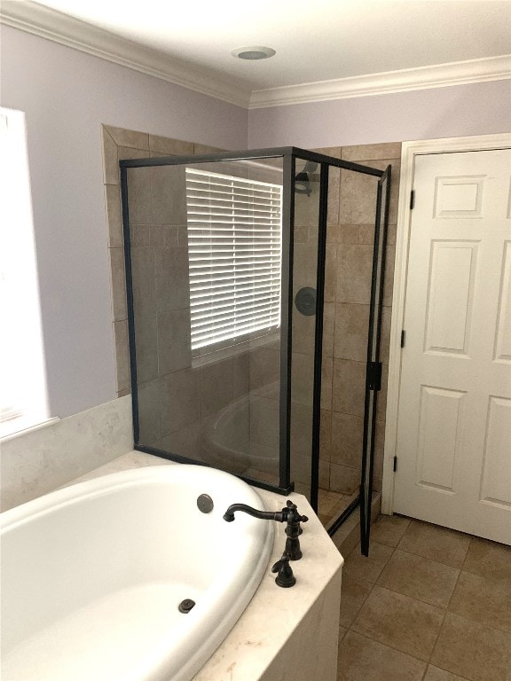 bathroom with crown molding, tile patterned flooring, and shower with separate bathtub