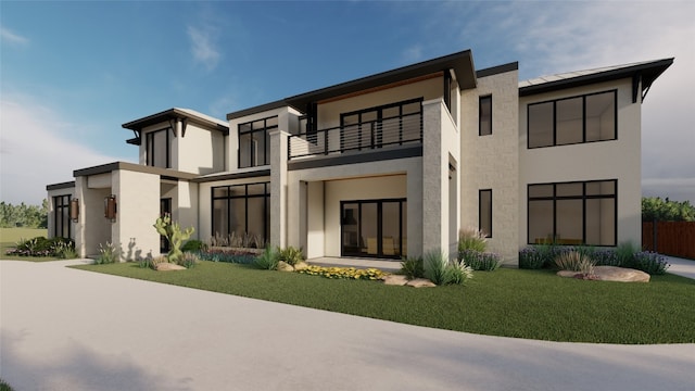 modern home featuring a balcony and a front yard