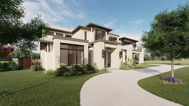 view of front facade featuring a balcony and a front yard