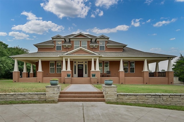 view of front of home with a front lawn and a porch