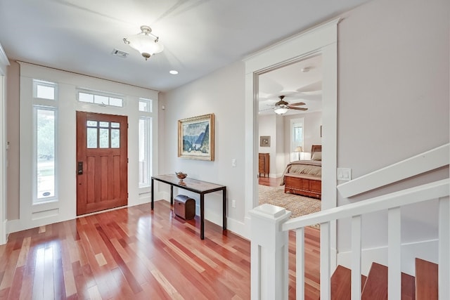 foyer featuring ceiling fan and light hardwood / wood-style floors