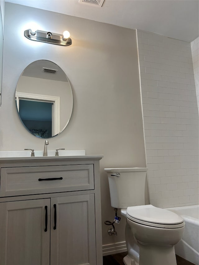 full bathroom featuring vanity, toilet, and shower / washtub combination