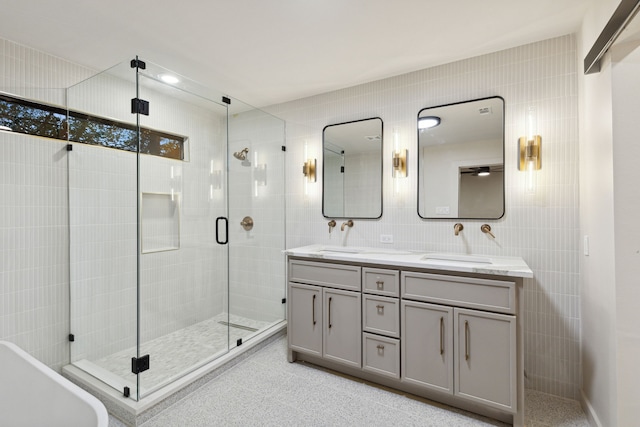 bathroom with plus walk in shower, decorative backsplash, vanity, and tile walls