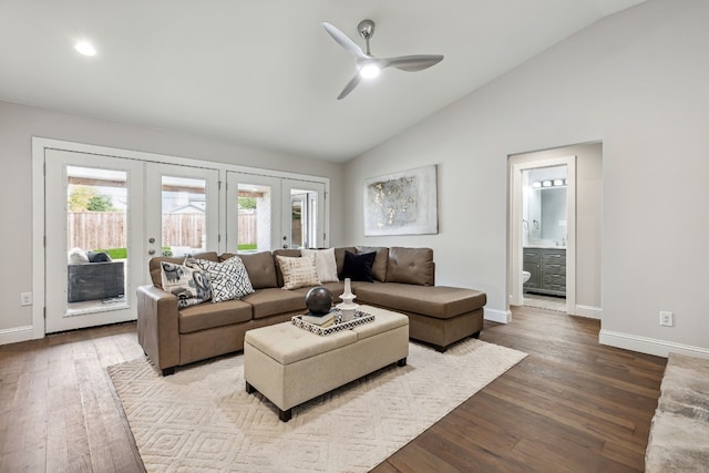 living room featuring baseboards, lofted ceiling, ceiling fan, wood finished floors, and french doors