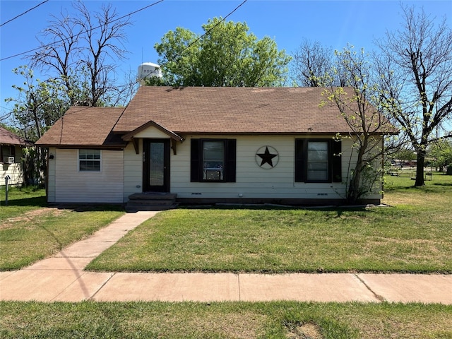 single story home featuring a front yard