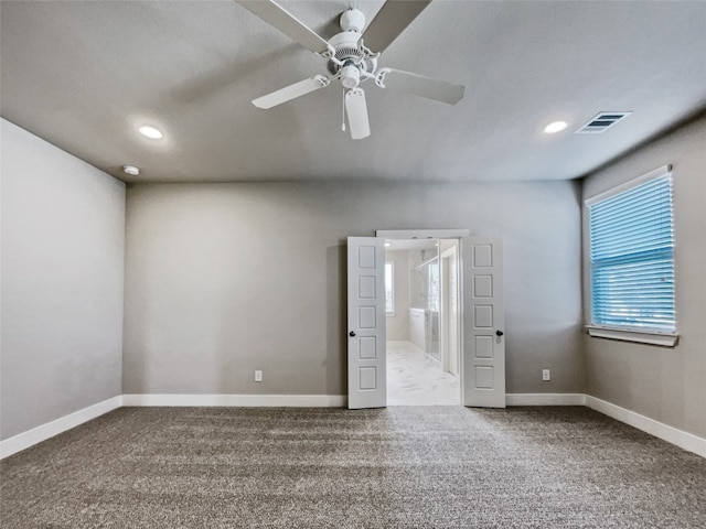 unfurnished room with light tile floors, ceiling fan, and a wealth of natural light