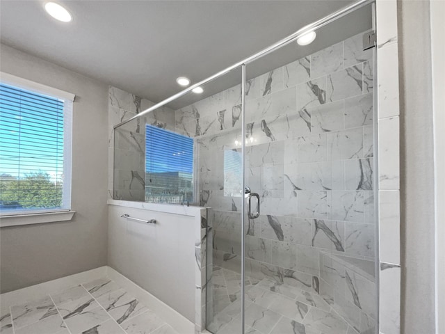 bathroom with walk in shower and tile floors