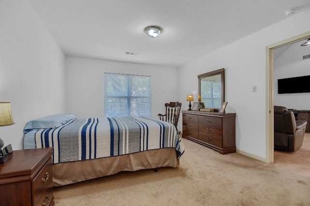 bedroom featuring light carpet