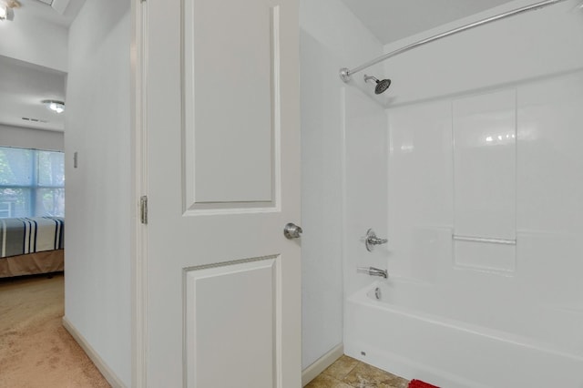 bathroom featuring  shower combination and tile flooring