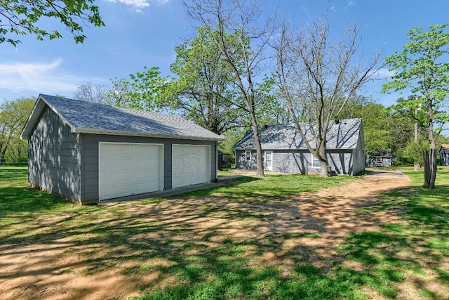 garage with a yard