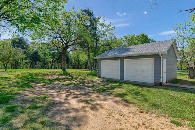 garage with a yard