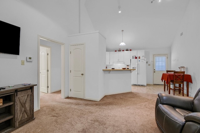 carpeted living room with vaulted ceiling