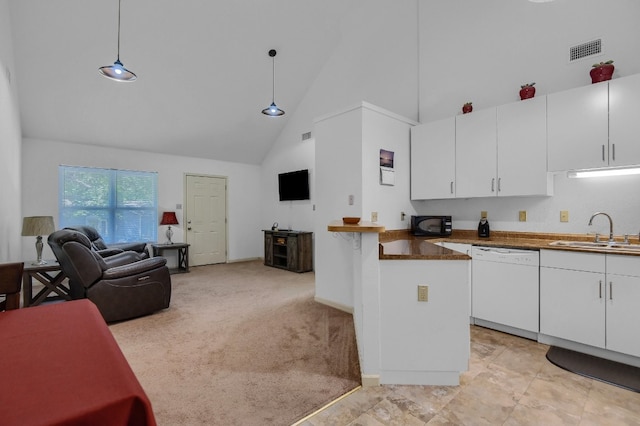 kitchen with white cabinets, dishwasher, sink, and pendant lighting