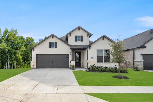 view of front of house featuring concrete driveway, a front lawn, stone siding, and stucco siding