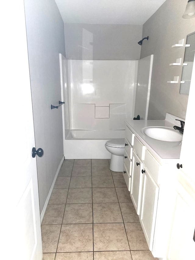 full bathroom featuring  shower combination, tile patterned floors, vanity, and toilet