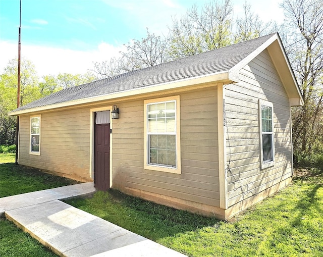 view of outdoor structure with a lawn