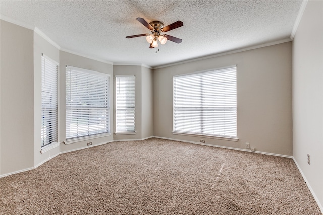 carpeted empty room with a textured ceiling, crown molding, and ceiling fan