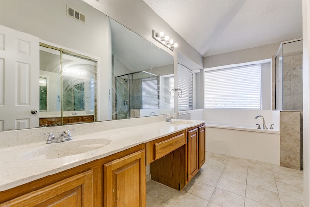 bathroom featuring vanity, lofted ceiling, a textured ceiling, shower with separate bathtub, and tile patterned flooring