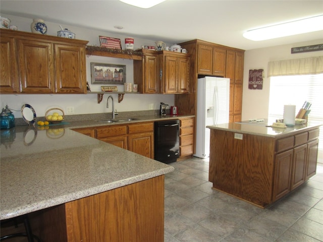 kitchen with sink, dishwasher, light stone countertops, tile flooring, and white fridge with ice dispenser