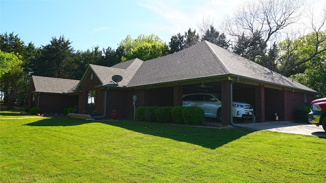 view of front facade with a front yard and a carport