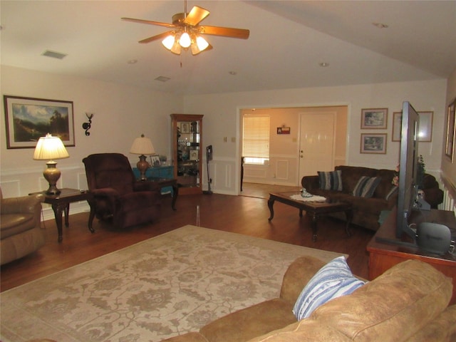 living room with hardwood / wood-style floors, lofted ceiling, and ceiling fan